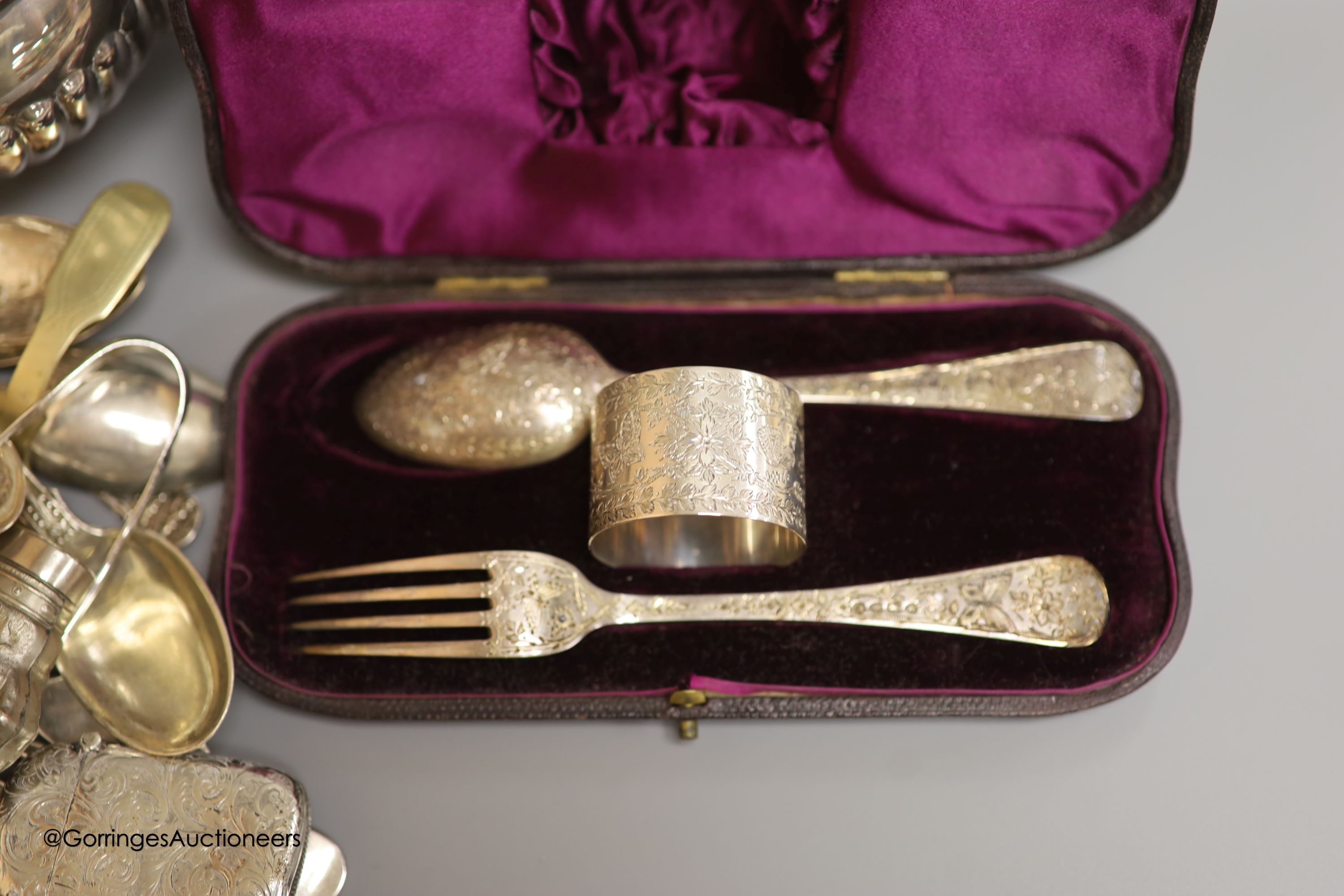 Assorted silver and plated wares including a silver mounted glass scent bottle, London, 1899, a similar cased christening trio, silver pill boxes, teaspoons and vesta case, plated tea set and minor items.